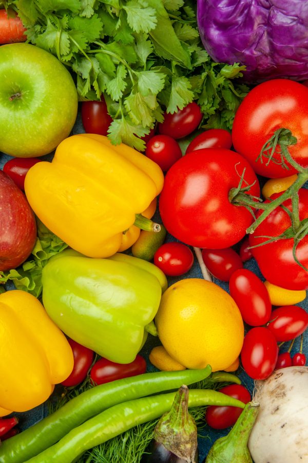 top-view-fruits-vegetables-cherry-tomatoes-lemon-tomatoes-apple-red-cabbage-coriander